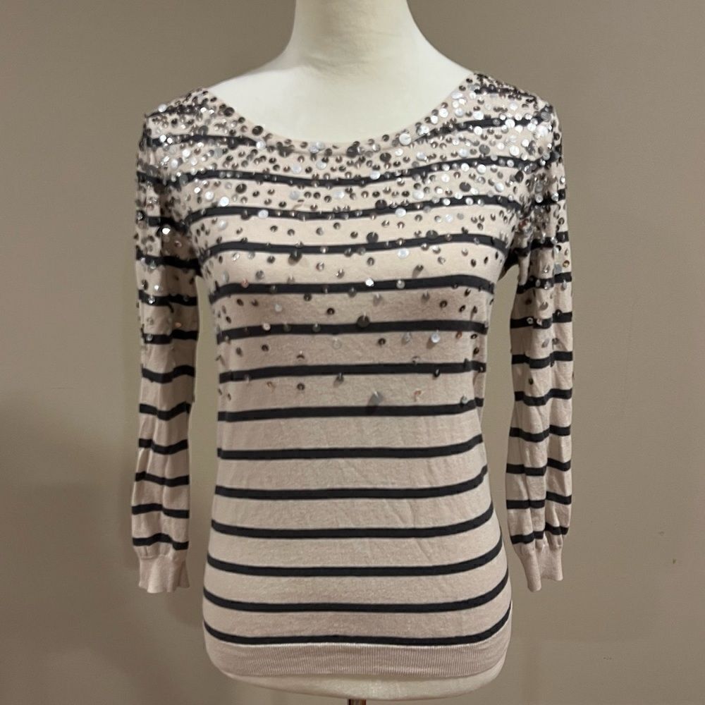 The Limited Cream sweater with black stripes and silver sequin detailing